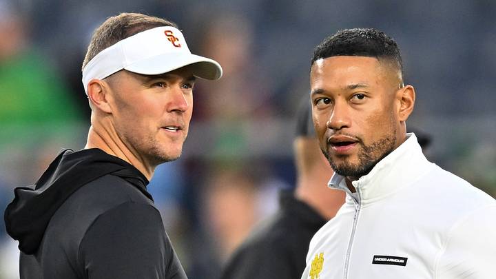 Oct 14, 2023; South Bend, Indiana, USA; USC Trojans head coach Lincoln Riley and Notre Dame Fighting Irish head coach Marcus Freeman chat before the game at Notre Dame Stadium. Mandatory Credit: Matt Cashore-USA TODAY Sports Oct 14, 2023; South Bend, Indiana, USA; USC Trojans head coach Lincoln Riley and Notre Dame Fighting Irish head coach Marcus Freeman chat before the game at Notre Dame Stadium. Mandatory Credit: Matt Cashore-USA TODAY Sports