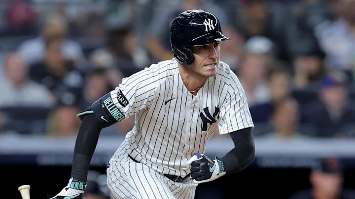 Sep 11, 2025; Bronx, New York, USA; New York Yankees center fielder Cody Bellinger (35) follows through on an RBI single against the Detroit Tigers during the fourth inning at Yankee Stadium. Mandatory Credit: Brad Penner-Imagn Images