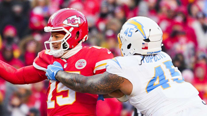 Dec 14, 2025; Kansas City, Missouri, USA; Los Angeles Chargers linebacker Tuli Tuipulotu (45) pressures Kansas City Chiefs quarterback Patrick Mahomes (15) during the fourth quarter at GEHA Field at Arrowhead Stadium. Mandatory Credit: Jay Biggerstaff-Imagn Images Dec 14, 2025; Kansas City, Missouri, USA; Los Angeles Chargers linebacker Tuli Tuipulotu (45) pressures Kansas City Chiefs quarterback Patrick Mahomes (15) during the fourth quarter at GEHA Field at Arrowhead Stadium. Mandatory Credit: Jay Biggerstaff-Imagn Images