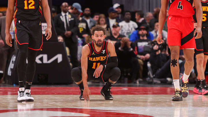 Trae Young (11) reacts after a miss against the Toronto Raptors