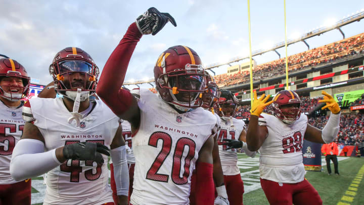 Nov 5, 2023; Foxborough, Massachusetts, USA; Washington Commanders cornerback Jartavius Martin (20) celebrates after an interception during the second half against the New England Patriots at Gillette Stadium. Mandatory Credit: Paul Rutherford-USA TODAY Sports Nov 5, 2023; Foxborough, Massachusetts, USA; Washington Commanders cornerback Jartavius Martin (20) celebrates after an interception during the second half against the New England Patriots at Gillette Stadium. Mandatory Credit: Paul Rutherford-USA TODAY Sports