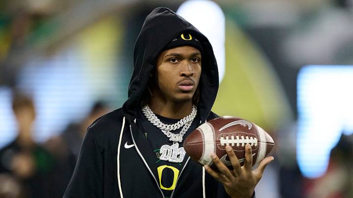 Nov 14, 2025; Eugene, Oregon, USA; Oregon Ducks wide receiver Dakorien Moore (1) watches teammates warm up before a game against the Minnesota Golden Gophers at Autzen Stadium. Mandatory Credit: Troy Wayrynen-Imagn Images