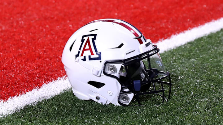 Sep 2, 2023; Tucson, Arizona, USA; Arizona Wildcats quarterback Jayden de Laura (7) helmet on the field after a victory over Northern Arizona Lumberjacks at Arizona Stadium. Mandatory Credit: Zac BonDurant-Imagn Images Sep 2, 2023; Tucson, Arizona, USA; Arizona Wildcats quarterback Jayden de Laura (7) helmet on the field after a victory over Northern Arizona Lumberjacks at Arizona Stadium. Mandatory Credit: Zac BonDurant-Imagn Images
