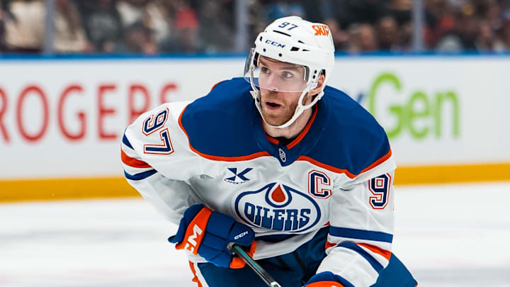 Jan 17, 2026; Vancouver, British Columbia, CAN; Edmonton Oilers forward Connor McDavid (97) handles the puck against the Vancouver Canucks in the third period at Rogers Arena. Mandatory Credit: Bob Frid-Imagn Images