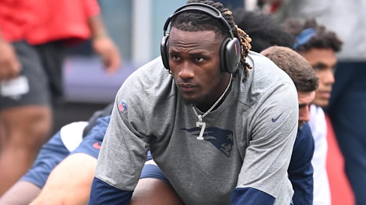 New England Patriots quarterback Joe Milton III (19) warms up before a game against the Carolina Panthers at Gillette Stadium.