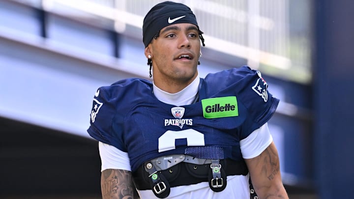 New England Patriots cornerback Christian Gonzalez (0) heads to the practice fields for training camp at Gillette Stadium.