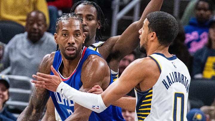 Dec 18, 2023; Indianapolis, Indiana, USA; LA Clippers forward Kawhi Leonard (2) looks to pass the ball while Indiana Pacers guard Tyrese Haliburton (0) defends in the second half at Gainbridge Fieldhouse. Mandatory Credit: Trevor Ruszkowski-Imagn Images