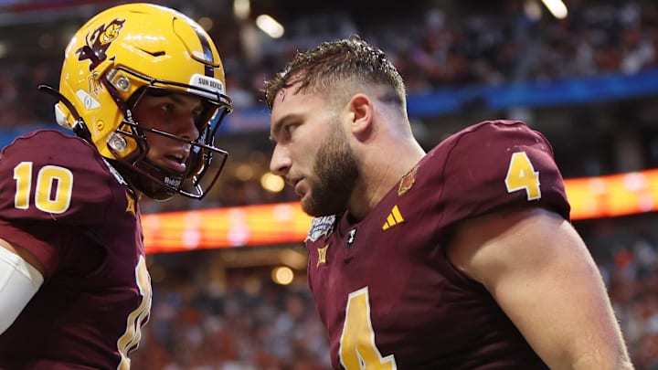 Jan 1, 2025; Atlanta, GA, USA; Arizona State Sun Devils running back Cam Skattebo (4) celebrates with quarterback Sam Leavitt (10) after scoring a touchdown against the Texas Longhorns during the second half of the Peach Bowl at Mercedes-Benz Stadium. Mandatory Credit: Brett Davis-Imagn Images