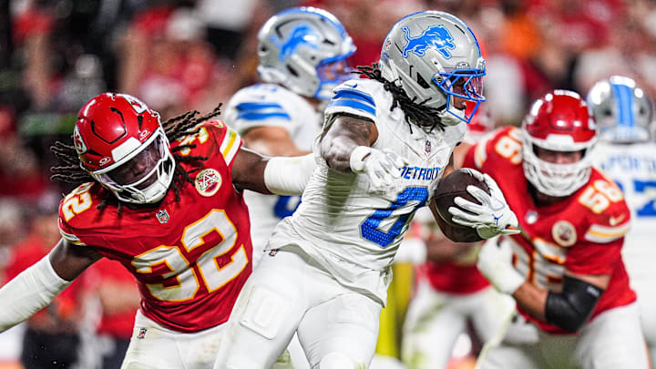 Detroit Lions running back Jahmyr Gibbs (0) runs against Kansas City Chiefs linebacker Nick Bolton (32) during the second half at Arrowhead Stadium in Kansas City, Missouri on Sunday, Oct. 12, 2025.