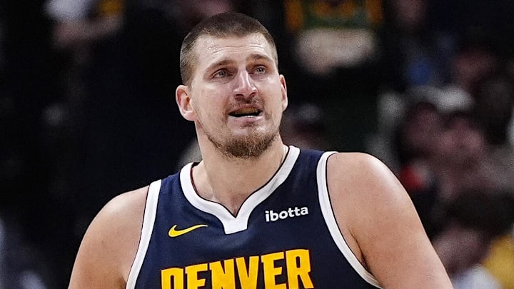 Dec 15, 2025; Denver, Colorado, USA; Denver Nuggets center Nikola Jokic (15) reacts after a three point basket in the fourth quarter against the Houston Rockets  at Ball Arena. Mandatory Credit: Ron Chenoy-Imagn Images