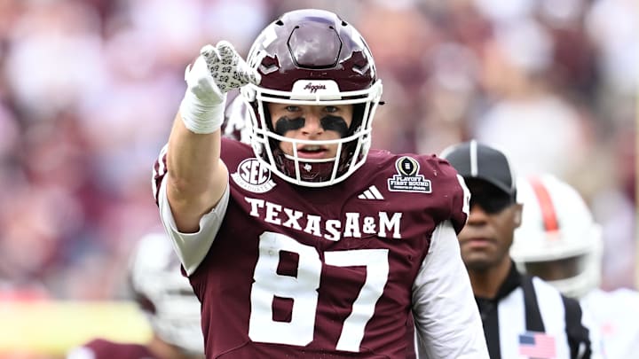 Dec 20, 2025; College Station, TX, USA; Texas A&M Aggies tight end Nate Boerkircher (87) celebrates a first down against the Miami Hurricanes during first quarter of the first round game of the CFP National Playoff at Kyle Field. 