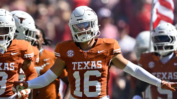 Texas Longhorns defensive back Michael Taaffe leads the team on to the field against the Oklahoma Sooners at the Cotton Bowl.