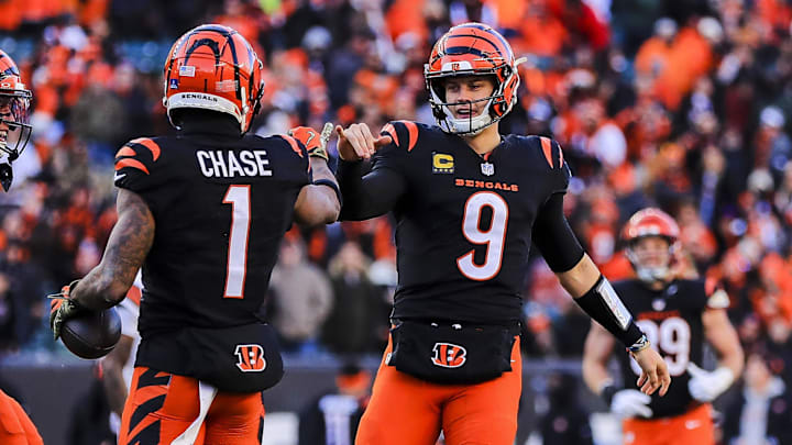 Dec 22, 2024; Cincinnati, Ohio, USA; Cincinnati Bengals wide receiver Ja'Marr Chase (1) reacts with quarterback Joe Burrow (9) after scoring a touchdown in the second half against the Cleveland Browns at Paycor Stadium. Mandatory Credit: Katie Stratman-Imagn Images