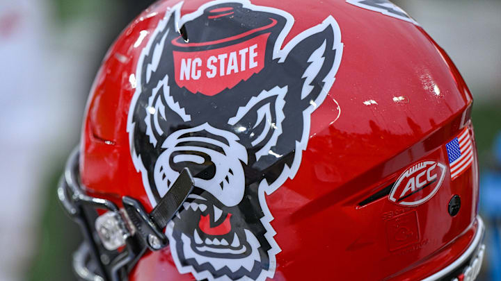 Nov 11, 2023; Winston-Salem, North Carolina, USA; The North Carolina State Wolfpack helmet rests on the bench during the second half against the Wake Forest Demon Deacons at Allegacy Federal Credit Union Stadium. Mandatory Credit: William Howard-Imagn Images