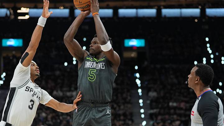 May 6, 2026; San Antonio, Texas, USA; Minnesota Timberwolves guard Anthony Edwards (5) shoots over San Antonio Spurs forward Keldon Johnson (3) in the first half during game two of the second round of the 2026 NBA Playoffs at Frost Bank Center. 