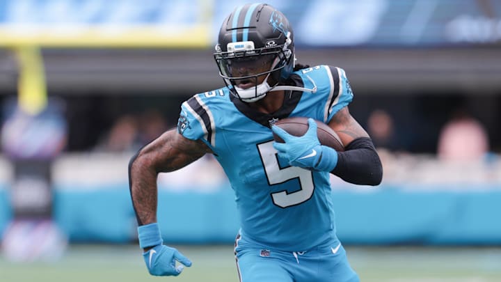 Oct 12, 2025; Charlotte, North Carolina, USA; Carolina Panthers running back Rico Dowdle (5) runs with the ball during the second half against the Dallas Cowboys at Bank of America Stadium. Mandatory Credit: Scott Kinser-Imagn Images
