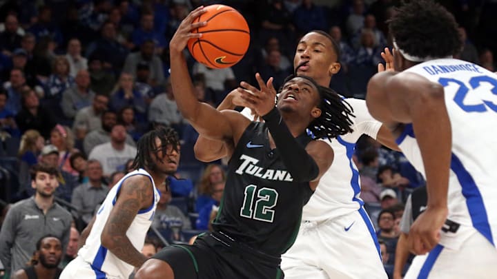 Feb 11, 2024; Memphis, Tennessee, USA; Tulane Green Wave guard Kolby King (12) drives to the basket during the second half against the Memphis Tigers at FedExForum. Mandatory Credit: Petre Thomas-Imagn Images
