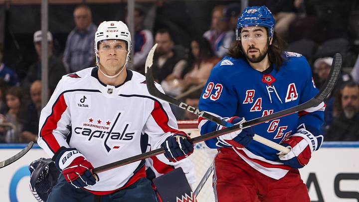 Apr 5, 2026; New York, New York, USA; Washington Capitals defenseman Jakob Chychrun (6) and New York Rangers center Mika Zibanejad (93) stand in front of the net during the first period at Madison Square Garden. Mandatory Credit: Danny Wild-Imagn Images