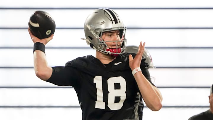 Ohio State Buckeyes offensive coordinator Chip Kelly watches Will Howard throw the ball.