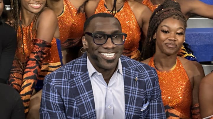 Shannon Sharpe poses with members of the Savannah State Marching Band after a broadcast of \"First Take\" at SSU Monday.