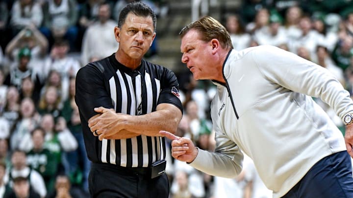 Illinois' head coach Brad Underwood, right, yells at a referee during the first half in the game against Michigan State on Sunday, Jan. 19, 2025, at the Breslin Center in East Lansing.