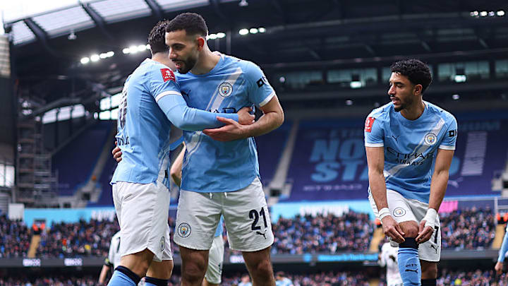 Man City squeezed past Salford.