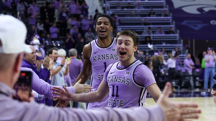 Feb 11, 2025; Manhattan, Kansas, USA; Kansas State Wildcats guard Brendan Hausen (11) and forward David N'Guessan (1) celebrate a win over the Arizona Wildcats at Bramlage Coliseum. Mandatory Credit: Scott Sewell-Imagn Images