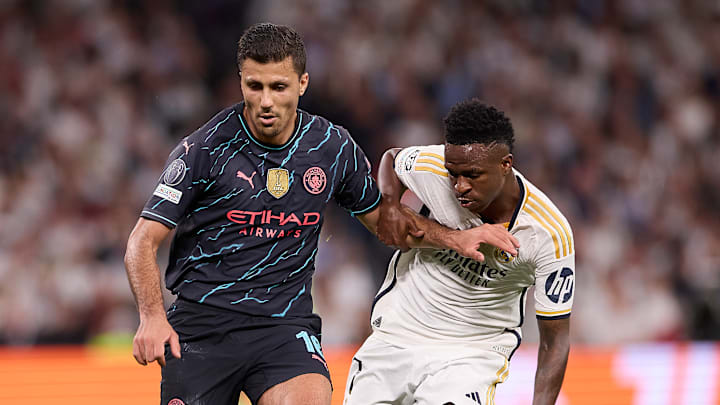 Rodrigo Hernandez Cascante, known as Rodri (L) of Manchester...