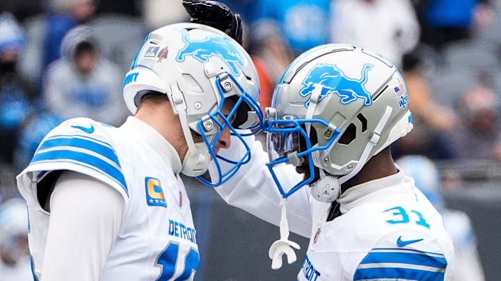 Detroit Lions quarterback Jared Goff (16), left, hugs safety Kerby Joseph (31) at warm up before the Bears game