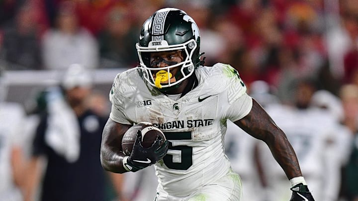Sep 20, 2025; Los Angeles, California, USA; Michigan State Spartans running back Makhi Frazier (5) runs the ball against the Southern California Trojans during the second half at the Los Angeles Memorial Coliseum. Mandatory Credit: Gary A. Vasquez-Imagn Images