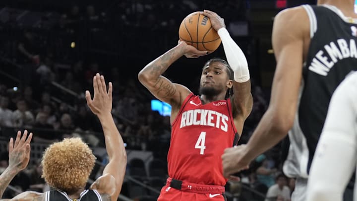 Oct 28, 2024; San Antonio, Texas, USA; Houston Rockets guard Jalen Green (4) shoots over San Antonio Spurs forward Jeremy Sochan (10) during the first half at Frost Bank Center. Mandatory Credit: Scott Wachter-Imagn Images