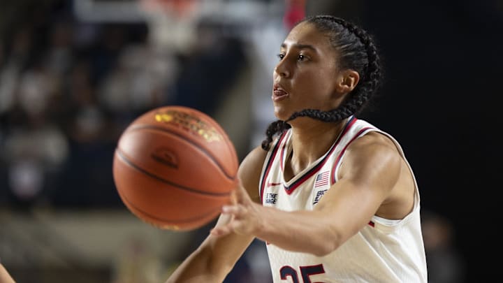 Nov 4, 2025; Annapolis, Maryland, USA ; UConn Huskies guard Azzi Fudd (35) passes as Louisville Cardinals guard Imari Berry (2) defends during the second half at Alumni Hall on United States Naval Academy. Mandatory Credit: Tommy Gilligan-Imagn Images Nov 4, 2025; Annapolis, Maryland, USA ; UConn Huskies guard Azzi Fudd (35) passes as Louisville Cardinals guard Imari Berry (2) defends during the second half at Alumni Hall on United States Naval Academy. Mandatory Credit: Tommy Gilligan-Imagn Images