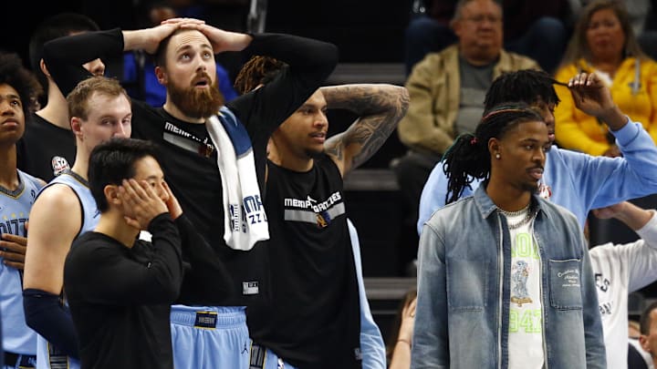 Nov 19, 2024; Memphis, Tennessee, USA; Memphis Grizzlies guard Ja Morant (left) and the Grizzlies bench react during the second half against the Denver Nuggets at FedExForum. Mandatory Credit: Petre Thomas-Imagn Images Nov 19, 2024; Memphis, Tennessee, USA; Memphis Grizzlies guard Ja Morant (left) and the Grizzlies bench react during the second half against the Denver Nuggets at FedExForum. Mandatory Credit: Petre Thomas-Imagn Images