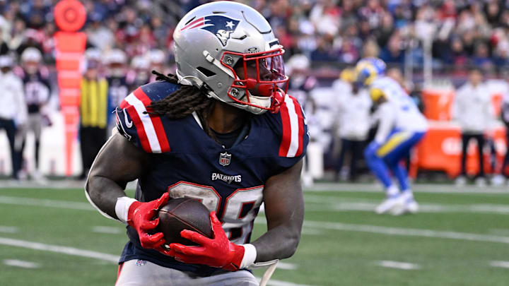 New England Patriots running back Rhamondre Stevenson (38) runs the ball against the Los Angeles Rams during the second half at Gillette Stadium.