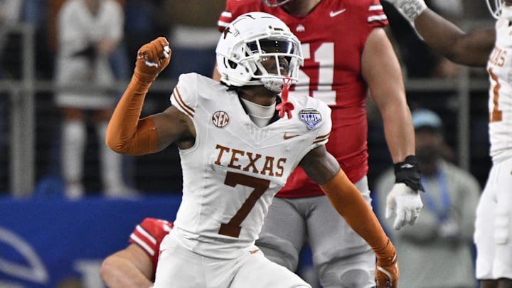 Jan 10, 2025; Arlington, Texas, USA; Texas Longhorns defensive back Jahdae Barron (7) celebrates after a sack during the second quarter of the College Football Playoff semifinal against the Ohio State Buckeyes in the Cotton Bowl at AT&T Stadium. Mandatory Credit: Jerome Miron-Imagn Images Jan 10, 2025; Arlington, Texas, USA; Texas Longhorns defensive back Jahdae Barron (7) celebrates after a sack during the second quarter of the College Football Playoff semifinal against the Ohio State Buckeyes in the Cotton Bowl at AT&T Stadium. Mandatory Credit: Jerome Miron-Imagn Images