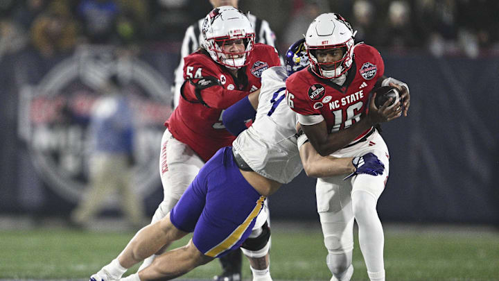 Dec 28, 2024; Annapolis, MD, USA; East Carolina Pirates defensive lineman J.D. Lampley (9) sacks North Carolina State Wolfpack quarterback CJ Bailey (16) during the first half of the Go Bowling Military Bowl at Navy-Marine Corps Memorial Stadium. Mandatory Credit: Tommy Gilligan-Imagn Images Dec 28, 2024; Annapolis, MD, USA; East Carolina Pirates defensive lineman J.D. Lampley (9) sacks North Carolina State Wolfpack quarterback CJ Bailey (16) during the first half of the Go Bowling Military Bowl at Navy-Marine Corps Memorial Stadium. Mandatory Credit: Tommy Gilligan-Imagn Images