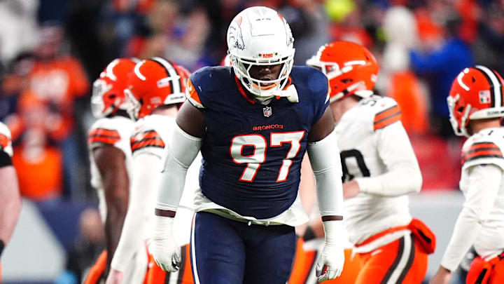 Dec 2, 2024; Denver, Colorado, USA; Denver Broncos defensive tackle Malcolm Roach (97) celebrates a missed field goal by the Cleveland Browns in the first quarter at Empower Field at Mile High. 