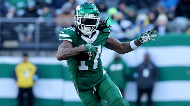 Dec 22, 2024; East Rutherford, New Jersey, USA; New York Jets wide receiver Davante Adams (17) runs with the ball against the Los Angeles Rams during the second quarter at MetLife Stadium. Mandatory Credit: Brad Penner-Imagn Images