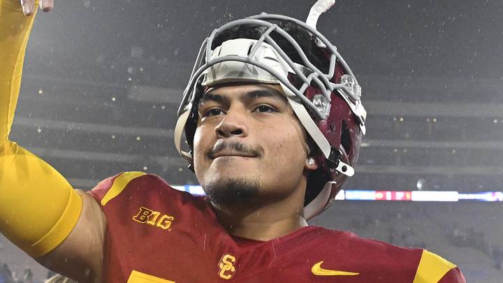 Nov 23, 2024; Pasadena, California, USA; USC Trojans quarterback Jayden Maiava (14) celebrates the win over UCLA at Rose Bowl. Mandatory Credit: Robert Hanashiro-Imagn Images Nov 23, 2024; Pasadena, California, USA; USC Trojans quarterback Jayden Maiava (14) celebrates the win over UCLA at Rose Bowl. Mandatory Credit: Robert Hanashiro-Imagn Images