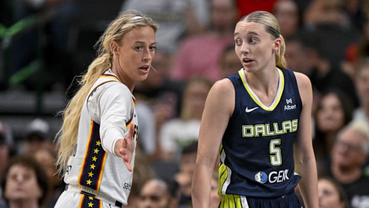 Aug 1, 2025; Dallas, Texas, USA; Dallas Wings guard Paige Bueckers (5) and Indiana Fever guard Sophie Cunningham (8) in action during the game between the Dallas Wings and the Indiana Fever at the American Airlines Center. Mandatory Credit: Jerome Miron-Imagn Images