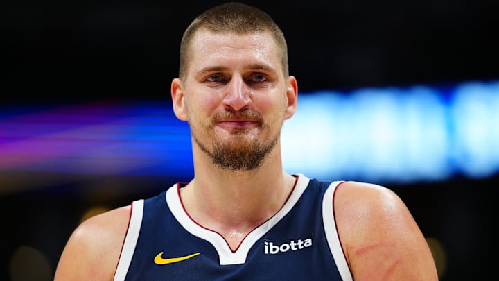 Dec 28, 2024; Denver, Colorado, USA; Denver Nuggets center Nikola Jokic (15) reacts in the fourth quarter against the Detroit Pistons at Ball Arena. Mandatory Credit: Ron Chenoy-Imagn Images