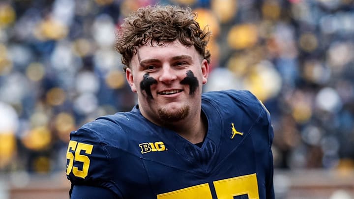 Blue Team defensive lineman Mason Graham (55) walks up the tunnel for halftime during the spring game at Michigan Stadium in Ann Arbor on Saturday, April 20, 2024.