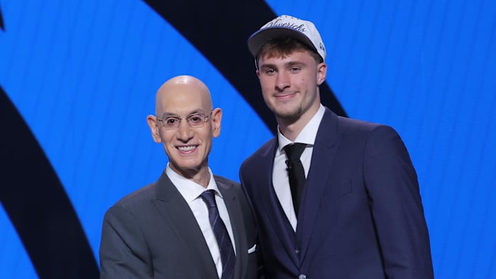 Jun 25, 2025; Brooklyn, NY, USA;  Cooper Flagg poses with NBA commissioner Adam Silver after being selected as first overall by the Dallas Mavericks in the first round of the 2025 NBA Draft at Barclays Center. Mandatory Credit: Brad Penner-Imagn Images