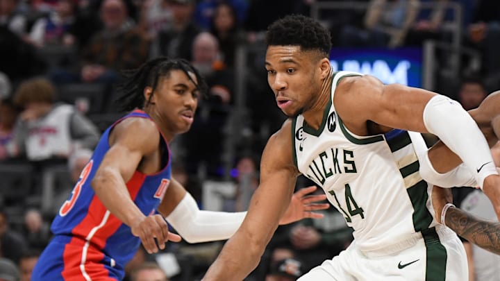 Jan 23, 2023; Detroit, Michigan, USA;  Milwaukee Bucks forward Giannis Antetokounmpo (34) drives between Detroit Pistons guard Jaden Ivy (23) (left) and forward Sadie Bey (41) in the third quarter at Little Caesars Arena. Mandatory Credit: Lon Horwedel-Imagn Images