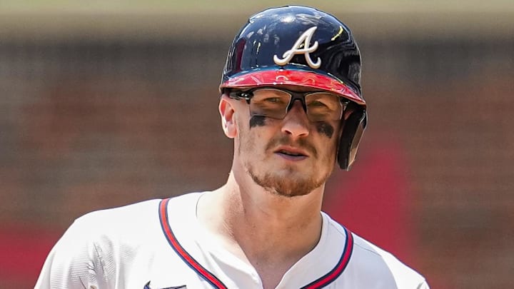 Atlanta Braves catcher Sean Murphy (12) arrives at second base in front of Baltimore Orioles first baseman Coby Mayo (16) after hitting a double during the seventh inning at Truist Park.