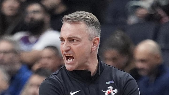Toronto Raptors head coach Darko Rajakovic calls out to his team during the first half against the Boston Celtics.