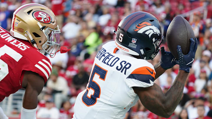 Aug 9, 2025; Santa Clara, California, USA;  Denver Broncos wide receiver Trent Sherfield Sr. (5) makes a touchdown catch over San Francisco 49ers cornerback Dallis Flowers (35) in the second quarter at Levi's Stadium. 