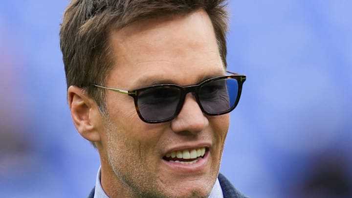 Oct 12, 2025; Baltimore, Maryland, USA; Fox Sports announcer Tom Brady looks on before the game between the Baltimore Ravens and the Los Angeles Rams at M&T Bank Stadium. Mandatory Credit: Mitch Stringer-Imagn Images Oct 12, 2025; Baltimore, Maryland, USA; Fox Sports announcer Tom Brady looks on before the game between the Baltimore Ravens and the Los Angeles Rams at M&T Bank Stadium. Mandatory Credit: Mitch Stringer-Imagn Images