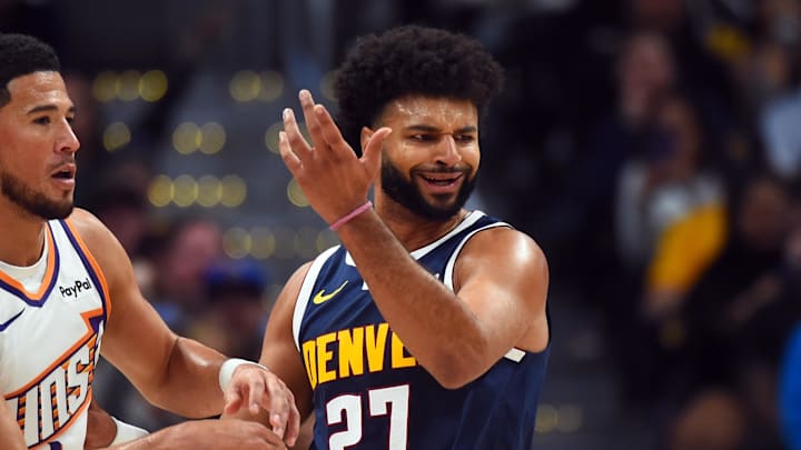 Oct 25, 2025; Denver, Colorado, USA; Denver Nuggets guard Jamal Murray (27) reacts after a play against Phoenix Suns guard Devin Booker (1) during the first half at Ball Arena. Mandatory Credit: Christopher Hanewinckel-Imagn Images Oct 25, 2025; Denver, Colorado, USA; Denver Nuggets guard Jamal Murray (27) reacts after a play against Phoenix Suns guard Devin Booker (1) during the first half at Ball Arena. Mandatory Credit: Christopher Hanewinckel-Imagn Images