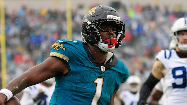 Jacksonville Jaguars running back Travis Etienne Jr. (1) scores a rushing touchdown during the second quarter of an NFL football game at EverBank Stadium, Sunday, Dec. 7, 2025, in Jacksonville, Fla. [Corey Perrine/Florida Times-Union]